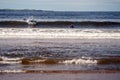 Lahinch town, Ireland - 08.06.2020 : Beautiful women surfing in the ocean in wet suit. Atlantic ocean. Outdoor activity, Aqua