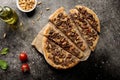 lahm bi ajeen pizza slice with nuts and tomato isolated on cutting board top view fastfood Royalty Free Stock Photo