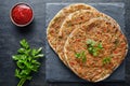 Lahmacun traditional turkish pizza with minced beef or lamb meat, paprika tomatoes, parsley baked spicy food