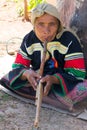 Lahu hilltribe woman playing a wind instrument in Chiang Rai province, Thailand