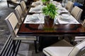 Laid dining table served with expensive white dishes
