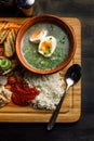 Laid dinner on the table, onion and egg soup, rice, chicken breast.