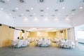 Laid festive tables with chairs stand in the banquet hall of the restaurant Royalty Free Stock Photo