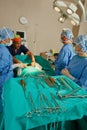 Laid out for life saving surgery. a team of surgeons performing a surgery in an operating room. Royalty Free Stock Photo