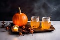 Laid table served with orange drinks is traditionally decorated with cut out jack-o\'-lanterns and lights for Halloween