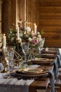 Laid Table By wedding banquet in a barn. Vertical frame Royalty Free Stock Photo