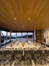 Laid tables with bouquets of dead wood on a terrace with columns