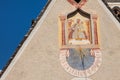 LAION, ITALY - SEPTEMBER 02, 2020: The recently restored clock and sundial painted outside the bell tower of the church of the