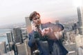 Lait again. Successful caucasian businessman in classic suit talking by phone and looking at his watch while standing Royalty Free Stock Photo