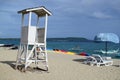 empty white lifeguard tower with cloudy sky in white sand beach Royalty Free Stock Photo