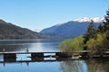 picturesque image in summer trees and gardens old wooden pier mountain, san martin de los andes neuquen argentina -