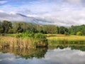 Lake against misty mountains