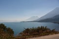 Lake Atitlan and volcanoes and road around it with view at San Pedro