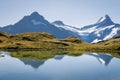 Lake Bachalpsee with snow covered mountain peaks in Bernese Alps, Switzerland Royalty Free Stock Photo