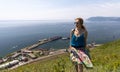 Lake Baikal, beautiful tourist girl on the background of Port Baikal