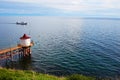 Lake Baikal on a summer day. Listvyanka village. The ship transports tourists Royalty Free Stock Photo