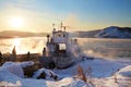 Lake Baikal at sunset. Ferry from the village of Listvyanka to the Port of Baikal lake shore in spring.