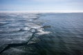 Lake Baikal in winter with open water and the edge of broken ice. Royalty Free Stock Photo