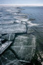 Lake Baikal in winter with open water and the edge of broken ice Royalty Free Stock Photo