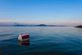 Lake Balaton with the Badacsony mountan in the background with a buoy in the foreground