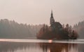 Lake Bled church landscape on a foggy morning day in winter Royalty Free Stock Photo