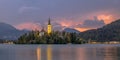 Lake bled with church under lightning stormy sky Royalty Free Stock Photo