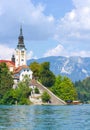 Lake Bled, Slovenia - August 20, 2018: A vertical view of Bled Island and its Assumption of Mary Church in summer
