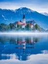 Lake Bled in Slovenia. Church on an island in the middle of the lake. Autumn landscape at dawn. Royalty Free Stock Photo