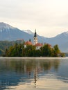 Iconic view of the Lake Bled in Slovenia. Church on an island in the middle of the lake. Summer landscape at dawn. Royalty Free Stock Photo