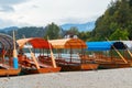 Lake Bled and traditional wooden Pletna at autumn