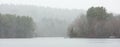 Lake with boat dock misty weather in color Royalty Free Stock Photo