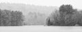 Lake with boat dock misty weather in black and white Royalty Free Stock Photo