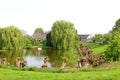 Scenic lake, boat and willows landscape in the Betuwe, Holland