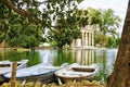 Lake, boats and The Temple of Esculapio is one of the many ancient building that a tourist can find in the beautiful