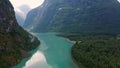 Lake bottom Loenvatnet with glacial river starting to flow dowm Lodalen valley. moving aerial