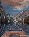 Lake Braies, Italy - Autumn sunrise at Lake Braies Lago di Braies in the Italian Dolomites at South Tyrol with wooden boats