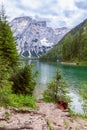 Lake Braies view from the shore. In the background Seekofel mountain Italian dolomite alps