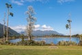 Lake Brunner (Moana) with Hohonu Range and ancient podocarp trees Royalty Free Stock Photo