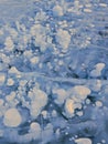 Lake Bubbles in White Underneath Frozen Lake Surface. Monochrome Patterns in the Ice.