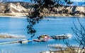 Long Wooden Pier And Boats At California`s Lake Cachuma With San Rafael Mountains