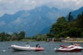 Lake Como, Italy - July 21, 2019: Fantastic summer landscape with boats on the lake. Beach near Colico in the Como lake region,