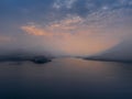 Lake Como with mountains at sunset. Cloudy sky. View from Bellagio, Italy. Colorful summer sunrise sunset on Lake Como. Alps, Ital