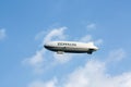 Airship, Zeppelin flying in the blue sky Royalty Free Stock Photo