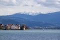 Lake Constance in the Lindau region against the backdrop of the snow-capped Alps. View of the island, the Powder Tower and