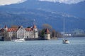 Lake Constance in the Lindau region against the backdrop of the snow-capped Alps. View of the island, the Powder Tower and