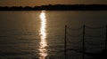 Lake after sunset with chain railing Royalty Free Stock Photo