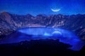 Lake in the crater of a volcano against the background of the starry sky. Reflection of the moonlight on the water. Indonesia. Rin