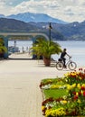 Lake cyclist and mountains in Klagenfurt, Worthersee