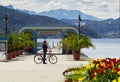 Lake cyclist and mountains in Klagenfurt, Worthersee