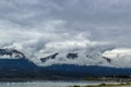 Lake Dillon in Colorado USA with cloud covered Rocky Mountains in distance and sailboats in the water